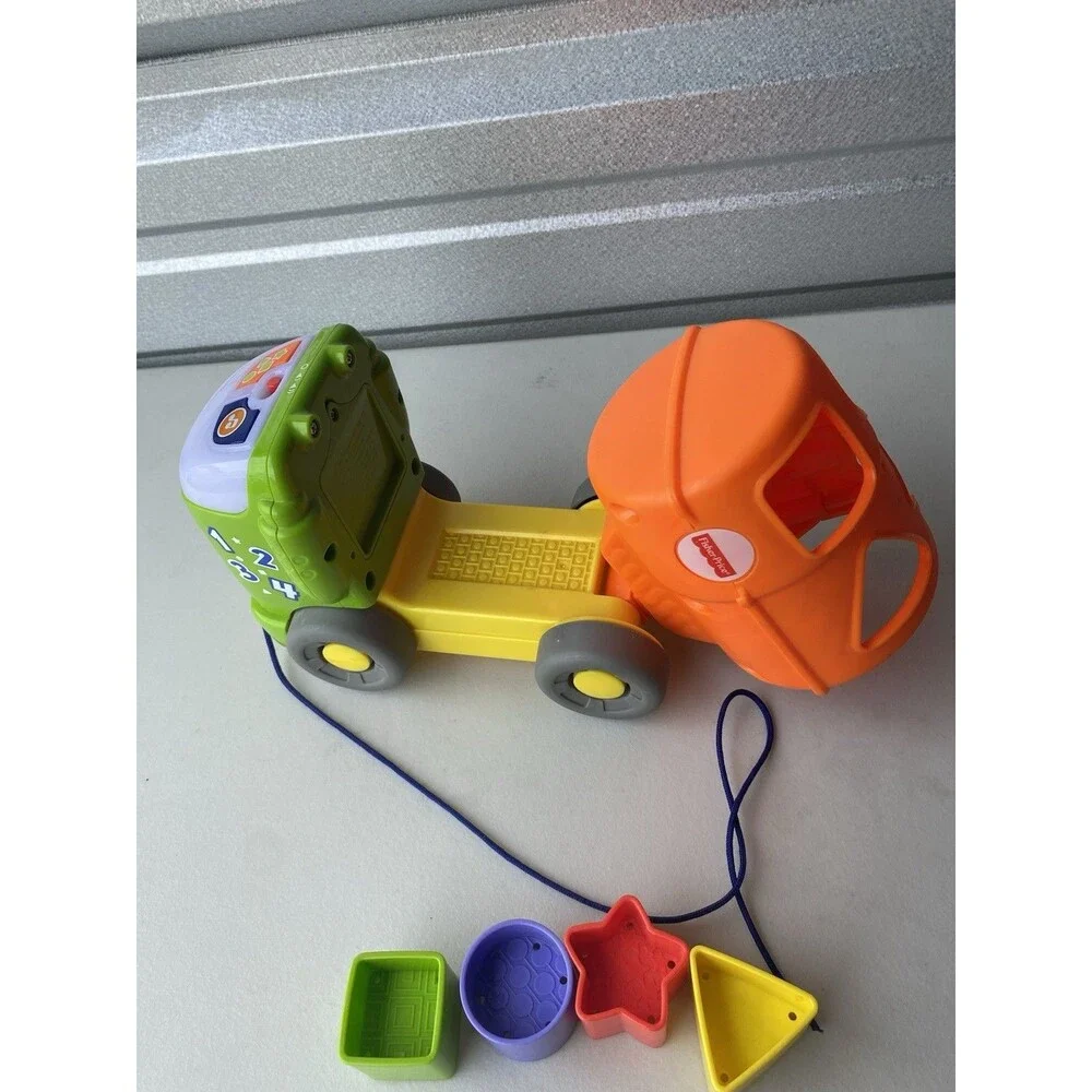 Fisher-Price Sort & Spill Learning Dump Truck Musical Shape Sorter